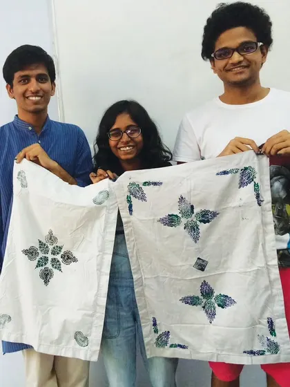 Students proudly displaying their finished block-printed fabric. Our textile art workshops are a great introduction to the world of fabric design.