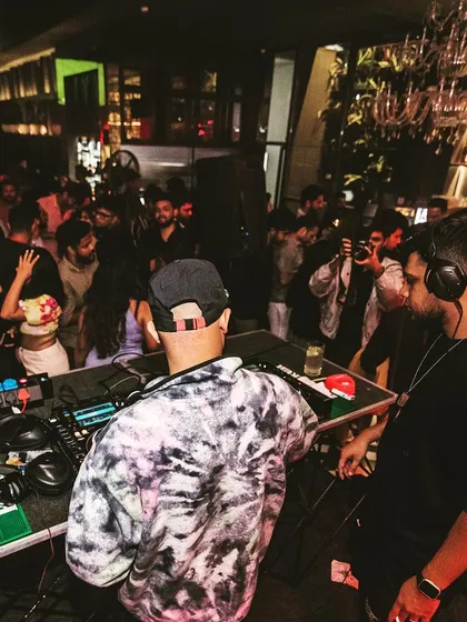 A shot from the DJ booth looking out over a full house. This perspective shows the connection between me and the audience.