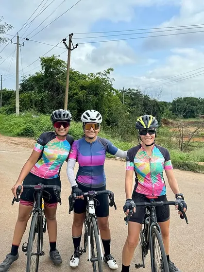 Three Spokies posing with their bikes on a scenic country road. Every ride is an opportunity to make new friends and strengthen existing bonds.