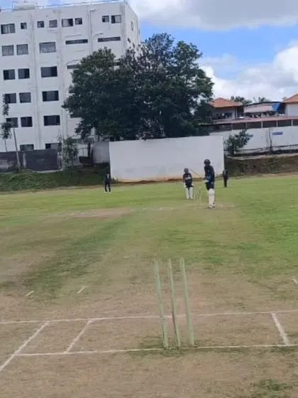 A match in progress against the Sri Lanka U-15 team, with our batsman facing their bowler on a turf wicket.