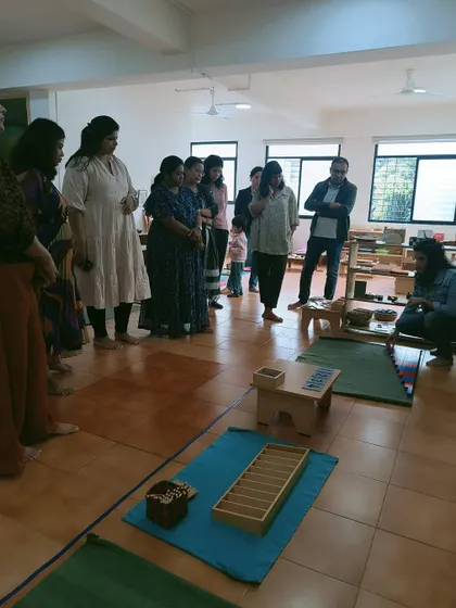 A parent orientation session in progress. These meetings are vital for bridging the gap between home and school, helping parents understand the Montessori method and their child's experience.