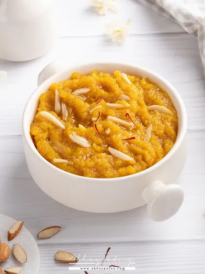 For this Moong Dal Halwa, I used a bright, high-key lighting setup to give the traditional dessert a fresh and modern look. The focus is on the rich texture and the garnish of slivered almonds.