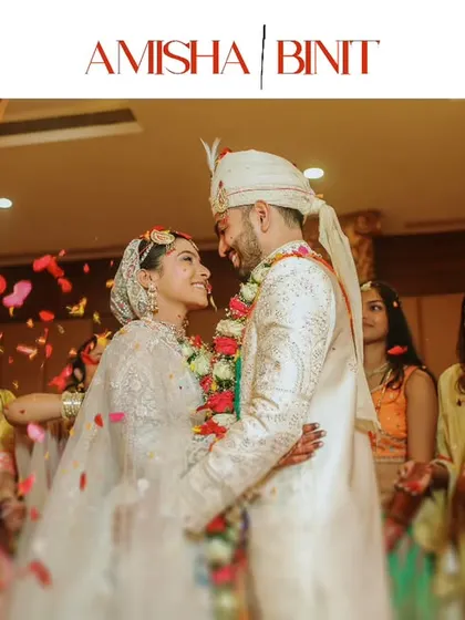 The couple shares a loving gaze as family and friends shower them with petals. We capture the wedding not just as a couple's union, but as a celebration of two families coming together.