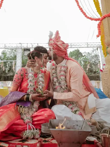 A sweet forehead kiss during a Maharashtrian wedding ceremony. These are the quiet, heartfelt moments that become cherished memories.