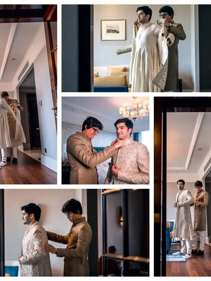 The groom getting help with his sherwani from a family member, a quiet moment of preparation before the main event.