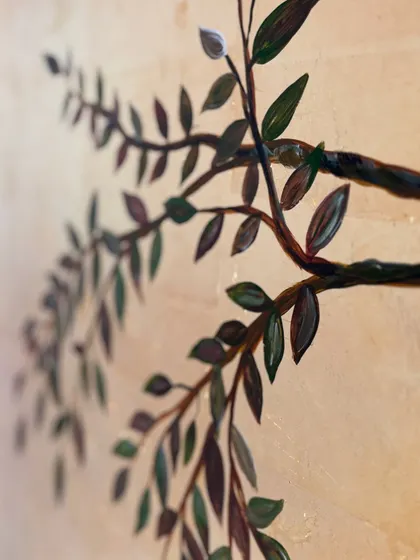 A macro shot focusing on the depth and shading of the leaves on the gold mural. I love playing with perspective to make the branches feel like they are reaching out from the wall.
