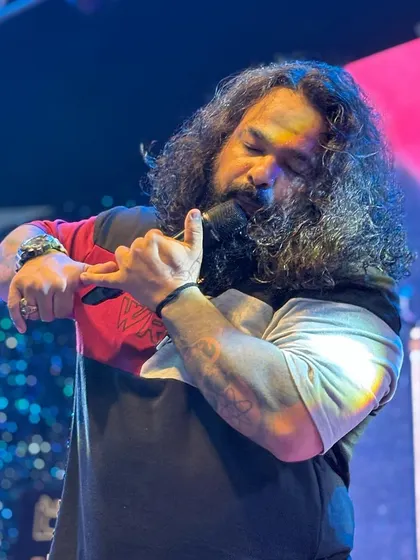 The emotion behind the music. Our frontman pouring his heart into a soulful melody during a live show.