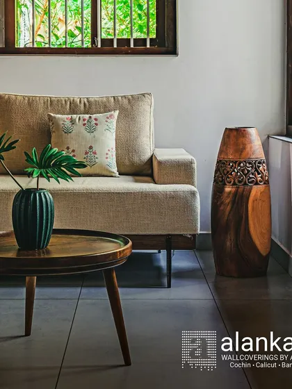 A duplicate shot of the minimalist sofa, emphasizing its clean lines and how it pairs beautifully with natural wood accents and indoor plants.