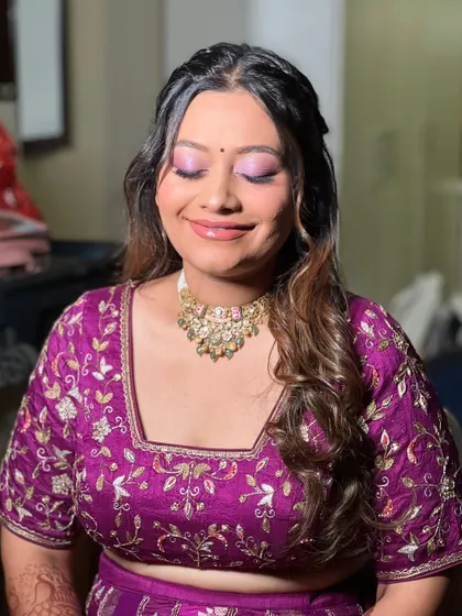 A close up of Nehal's Mayera look. The shimmery purple on her lids is playful yet elegant, perfect for a traditional family function.