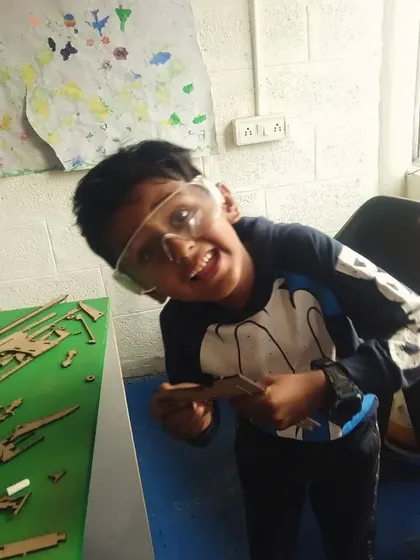 That look of pure fun and excitement is what our workshops are all about. This student is ready to build!