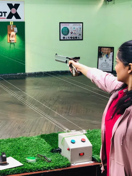 This shooter takes aim at our green-themed range, which offers a unique and pleasant practice environment.