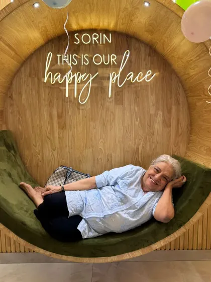 A client completely at ease, lounging in our signature circular chair. This is the picture of pure relaxation that we aim to provide.