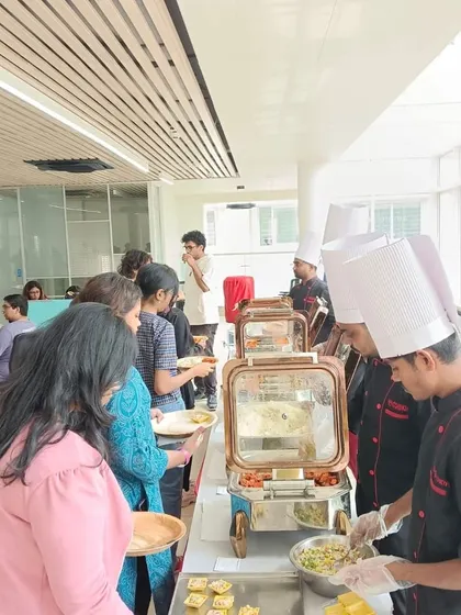 Our chef serving fresh snacks from a live counter at an RV University event. Interactive food stations are a great way to engage attendees at campus events.
