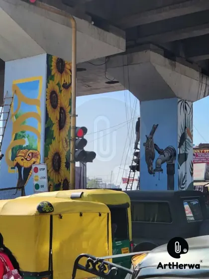 A work-in-progress shot of the pillar paintings, showing the combination of a 3D snake mural and a sunflower mural.