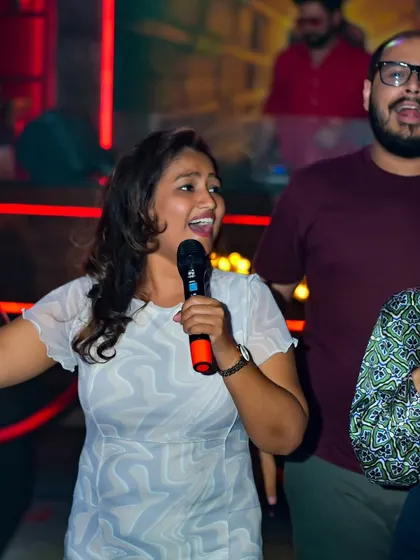 A group performance in full swing. There's nothing like singing a classic anthem with your friends, and I always encourage group numbers to get more people involved.