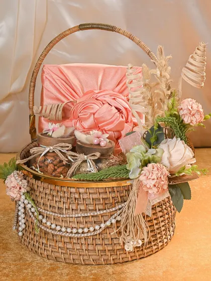 A closer look at the details of this stunning Rakhi basket. The combination of the satin-wrapped box, pearl strings, and dried flowers creates a truly luxurious and memorable gift.