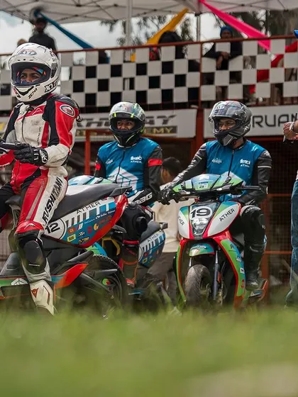 Amateur riders on their Ather electric scooters, lined up and ready for their track training session. We provide guidance to ensure everyone, even first-timers, can race safely.