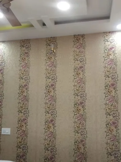 A striped floral wallpaper, adding a traditional touch to this room.