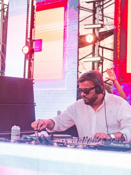 At the decks during a Holi festival, with a can of Budweiser keeping me company.