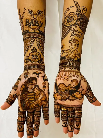 A sweet and detailed baby shower henna design. This piece includes a portrait of a mother holding her baby, another baby sleeping on the moon, and cute elements like a bunny and a 'Welcome Baby' message.