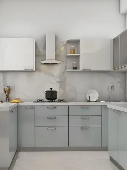 A light and airy U-shaped kitchen in a soft grey. The frosted glass cabinets and open shelving with basket storage add different textures and make the space feel very custom.