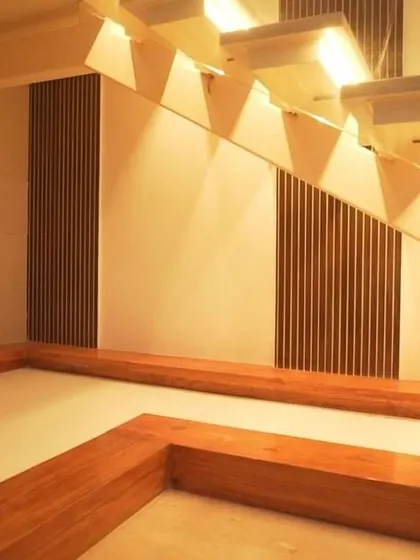 Another view of the stunning illuminated staircase, with a wooden base that can be used for seating or display.