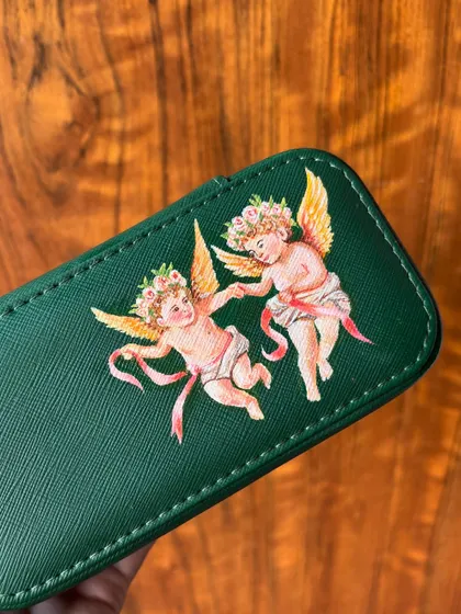 A close-up of the cherubs I painted. I love incorporating these timeless styles into my work and can't wait to create more pieces like this.