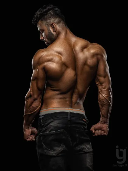 Crafted, not given. This back shot from a professional photoshoot highlights the detail and separation that comes from a disciplined prep.