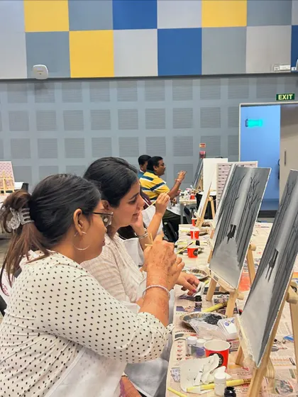 Two participants at the Adobe event, enjoying the painting process. My workshops are a judgment-free zone where fun is the only goal.