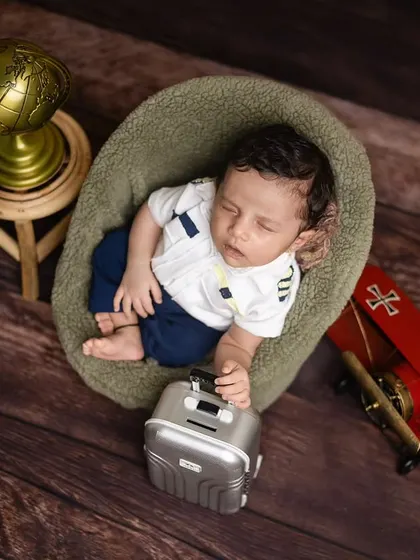 A close-up of the little pilot, sleeping peacefully in his chair before his next big flight.