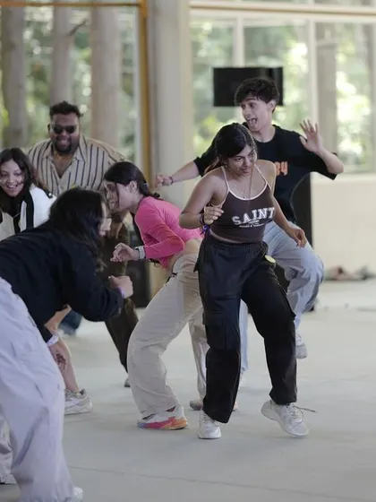 A fun, social moment between dancers at Spectra 2024.