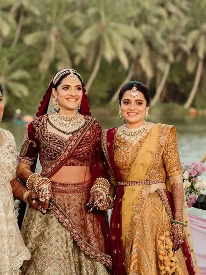 A beautiful portrait of the bride with her mother and sister on the boat, a cherished family moment before the ceremony begins.