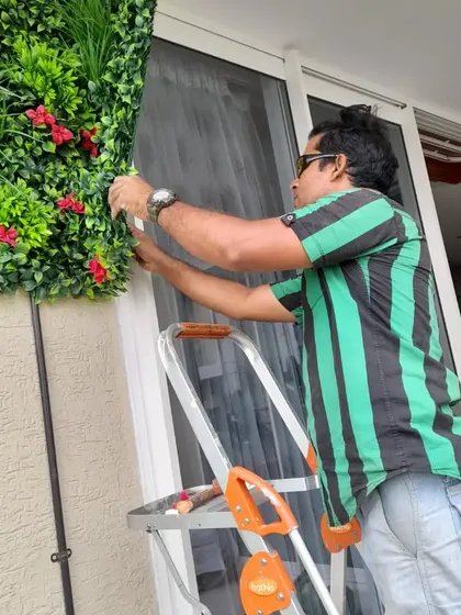 A different angle of the installation process. Precision is key to making these artificial walls look great and cover the wall space perfectly next to windows and doors.