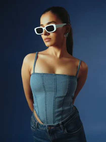 A clean and stylish shot of a denim corset top. This type of image is perfect for e-commerce, showing the product clearly and attractively.
