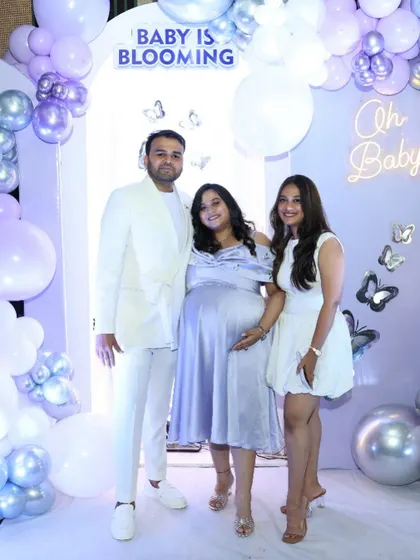 Another lovely photo of the couple with a guest, enjoying the elegant setup.
