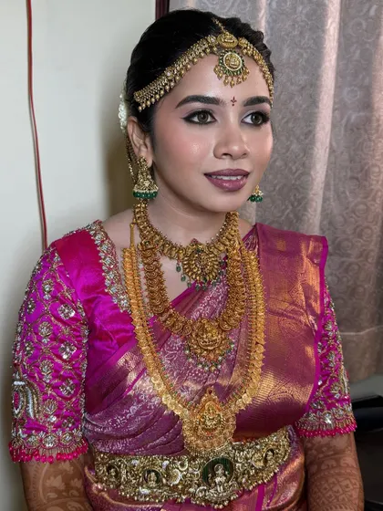 A beautiful profile shot showing the defined eyes and the perfect lip color that complements the entire look. This is the attention to detail I teach in my courses.