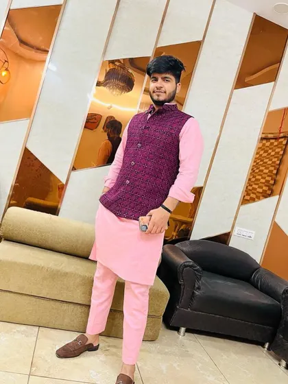 Another view of the pink kurta set with a purple Nehru jacket, showing how the colors complement each other for a vibrant, festive look.