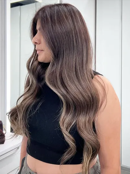 A beautiful example of my signature balayage, with soft waves that showcase the multi-tonal color and expert blending.