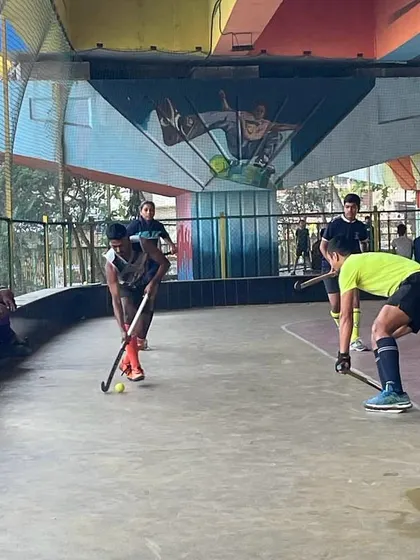 An intense face-off during our rink hockey practice at the unique indoor facility in Sanpada. These sessions are crucial for developing the fast-paced skills needed for tournament play.