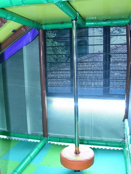 A view of our fireman's pole, a thrilling feature within our multi-level play structure that kids love.