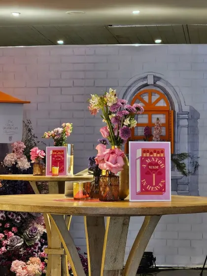 A high-top table with custom event stationery. Even the smallest details are considered to ensure the theme is carried through every aspect of the event, creating a polished and well-executed celebration.