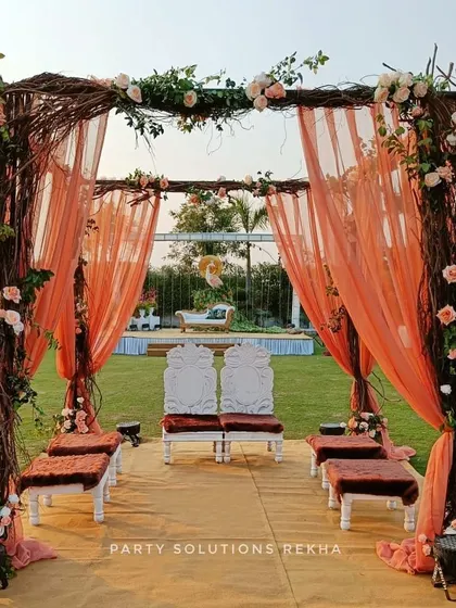 For couples who dream of a natural, romantic setting, I design rustic mandaps like this one. The structure of intertwined branches, soft peach draping, and delicate floral accents creates an earthy yet elegant space for the sacred wedding ceremony.