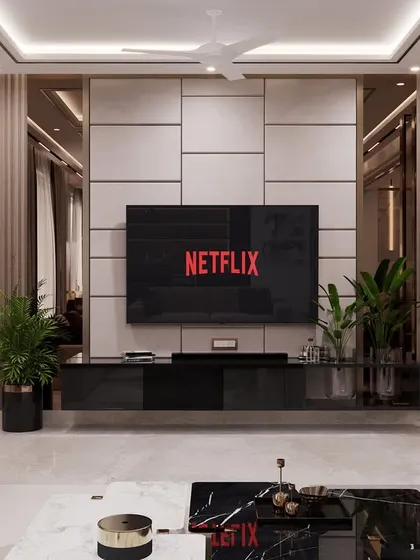 The focal point of this room is the stunning TV wall, which combines fluted wood panels, mirrors, and a sleek black console. This design proves that a media unit can be a powerful statement piece.