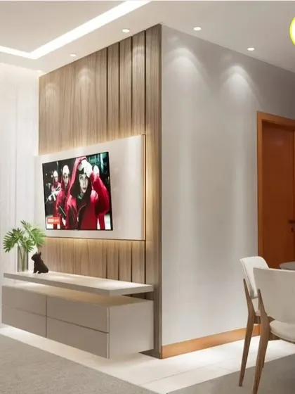 A side view of a TV unit with a wooden fluted panel, showcasing the clean installation and ambient side lighting we incorporate into our designs.