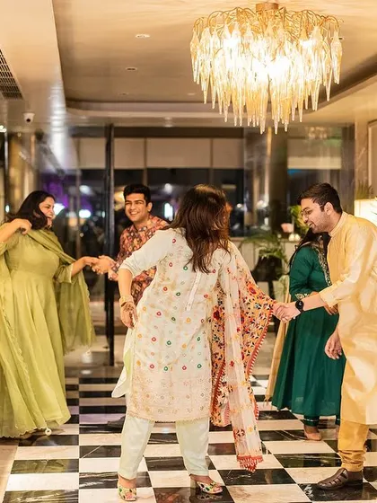 Sometimes the most memorable dance moments happen off the stage. Here's the family breaking into a spontaneous dance in the hotel lobby, just pure, unscripted fun.
