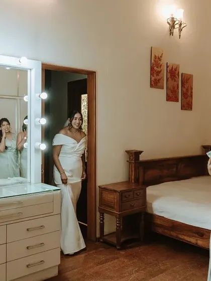 The bride's 'first look' for her bridesmaids. Their expressions of awe and happiness are a beautiful testament to friendship and love.