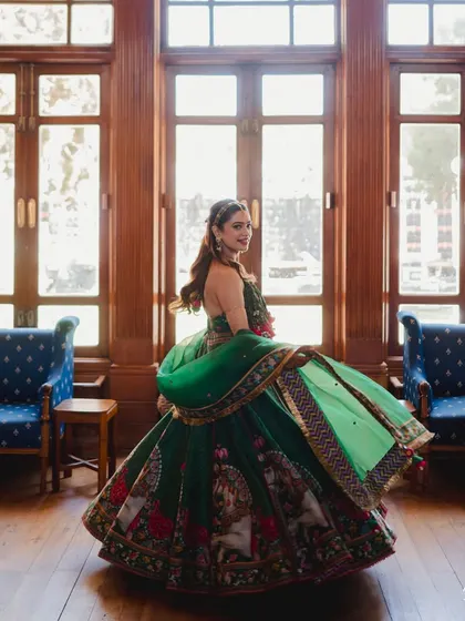 A classic twirl shot! The bride's lehenga looks stunning against the beautiful interiors of her home in Ooty.