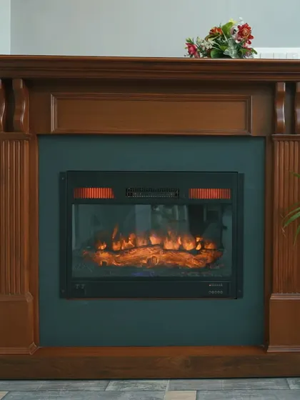 A classic fireplace design with a traditional wooden mantelpiece. This element adds a touch of timeless elegance and warmth to the living room.