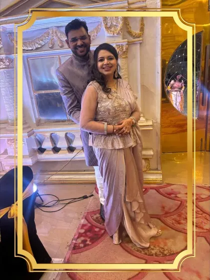 Another look at this stylish couple. The groom's Jodhpuri jacket and the bride's peplum-style top create a unique silhouette that’s perfect for a sangeet or engagement party.