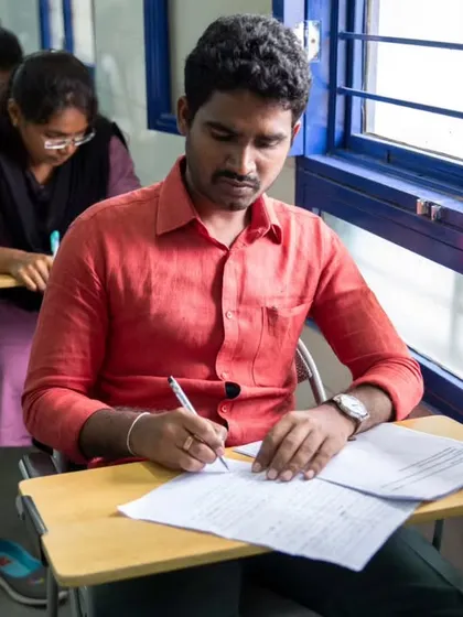 A student focused during a written examination. Our certification process is thorough and prepares learners for international language tests.